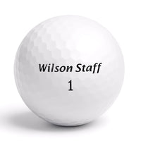 Närbild på Wilson Staff FG Tour golfboll med logga